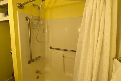 a bathroom with a shower with a shower curtain at Cozy Cottage in the Catskills! in Oak Hill