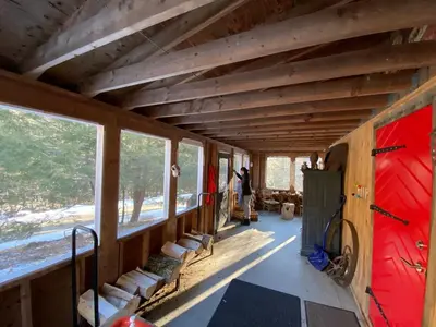 a room with wooden ceilings and windows in a house at The Glow Room at Indian Hollow in Chesterfield