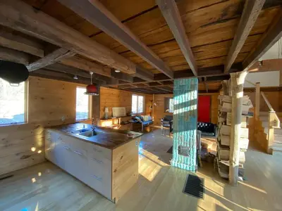 a kitchen with wooden walls and a wooden ceiling at The Glow Room at Indian Hollow in Chesterfield