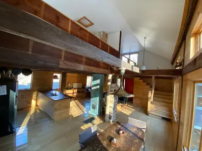 an overhead view of a kitchen and living room with wooden walls at The Glow Room at Indian Hollow in Chesterfield