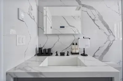 a white bathroom with a sink and a mirror at Catskills Mountain Retreat - Luxury Meets Serenity in Jewett