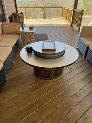 a living room with a coffee table on a deck at Catskills Mountain Retreat - Luxury Meets Serenity in Jewett