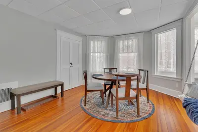 a dining room with a table and chairs at West Hartford Center- Charming New England Apt in West Hartford
