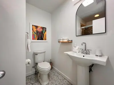 a white bathroom with a toilet and a sink at Luxury Woodstock Retreat Hot tub heated pool in Woodstock