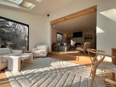 a living room with white furniture and a large window at Luxury Woodstock Retreat Hot tub heated pool in Woodstock