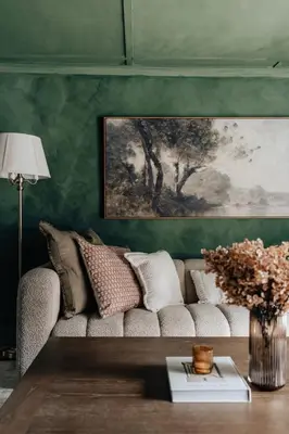 a living room with a couch and a painting at Majestic views Hot tub Firepit Games Sleeps 14 in Hillsdale