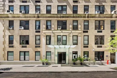 a large brick building with a door in front at 73-1509 New Studio UWS Doorman Gym in New York