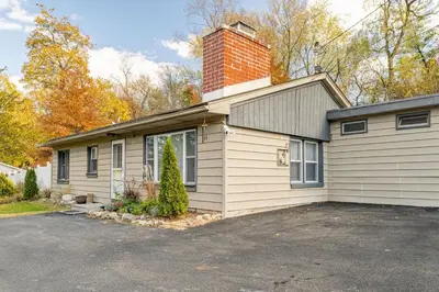 a house with a brick chimney on top of it at The Meyer spacious family home with hot tub in New Paltz
