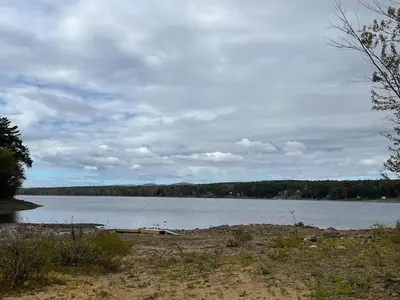 a large body of water with trees in the background at Twin pines 3 in Northville