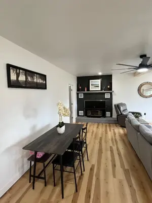 a living room with a table and a couch at Twin pines 3 in Northville