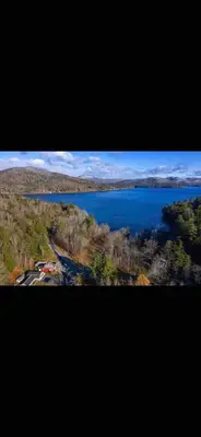 an aerial view of a lake in the countryside at Brooks bay in Lake Luzerne