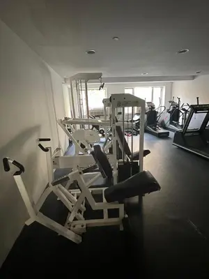 a room with a gym with several tread machines at 4 PEEPS Apt INWILLIAMSBURG in Brooklyn