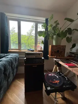 a living room with a couch and a window at 4 PEEPS Apt INWILLIAMSBURG in Brooklyn