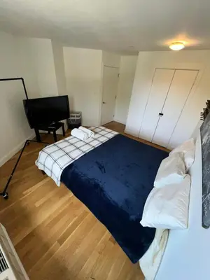 a bedroom with a large bed and a desk at 4 PEEPS Apt INWILLIAMSBURG in Brooklyn