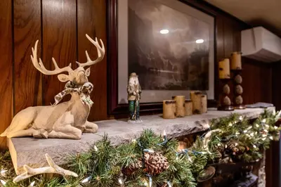a reindeer sitting on a counter with christmas decorations at Lakehouse with Boats, MiniGolf, Sauna, HotTub, Swings and Playground! in Pocono Summit