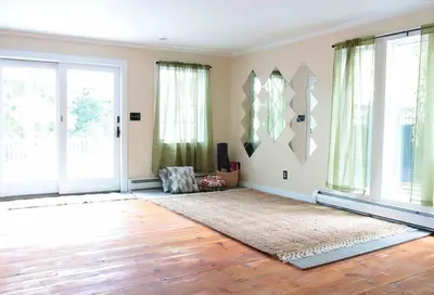 a living room with a large window and a rug at Bright, Airy Home in Hudson! in Hudson