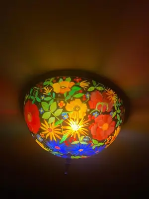 a colorful light fixture hanging from a ceiling at 4BR ski on ski off Hunter Mountain Highlands Condo in Hunter