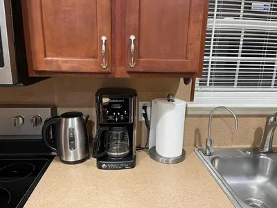 a kitchen counter with a coffee maker and a toaster at Gorgeous house private pool hot tub playroom in Long Pond