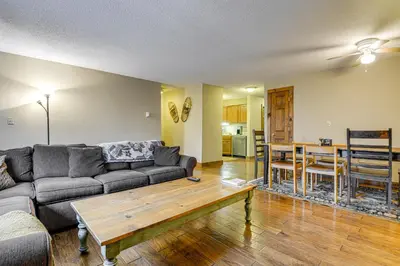 a living room with a couch and a table at Less Than 1 Mi to Mt Snow Charming Condo with Fireplace in Dover