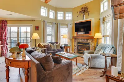 a living room with couches and a fireplace at Less Than 1 Mi to Mountain Creek Resort Condo with Balcony in Vernon Township
