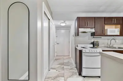 a kitchen with a sink and a stove at The Luxe Nook, Premier Studio in Scenic Congers in Congers