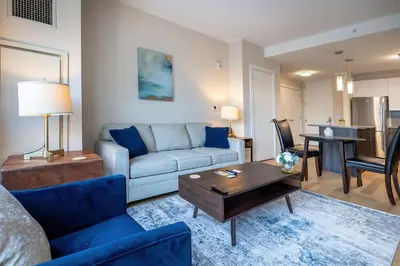 a living room with a couch and a table at Modern Apt Downtown in Stamford