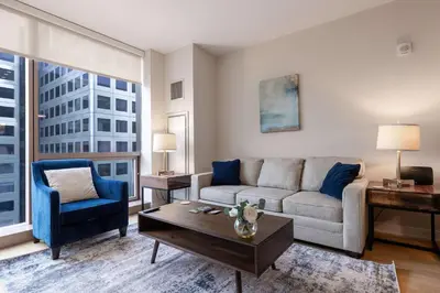 a living room with a couch and a table at Modern Apt Downtown in Stamford