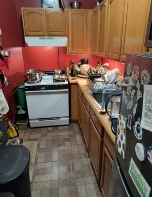 a kitchen with a stove and a refrigerator at My apartment in New York