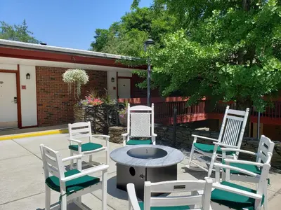a group of white chairs sitting around a table at The Inn at Crumpin-Fox in Bernardston