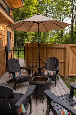 a patio with two chairs and an umbrella at Sauger home in Saugerties