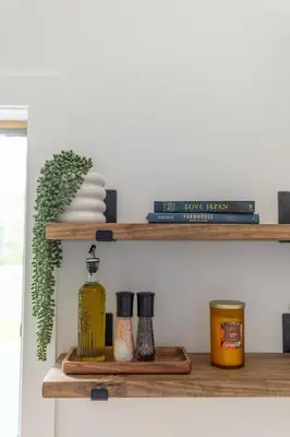 a shelf with books and other items on it at Sauger home in Saugerties