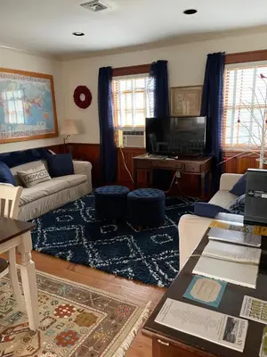 a living room with a couch and a tv at White hollow farm in Salisbury