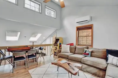 a living room with a couch and a piano at EVPg in Lehigh