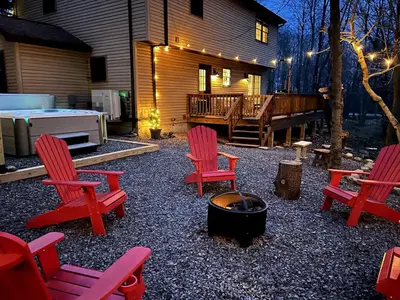 a backyard with red chairs and a fire pit at EVPg in Lehigh