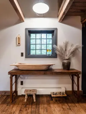 a bathroom with a large stone sink on a wooden table at Chic Catskills Cabin with Hot Tub and Fire Pit in Lanesville