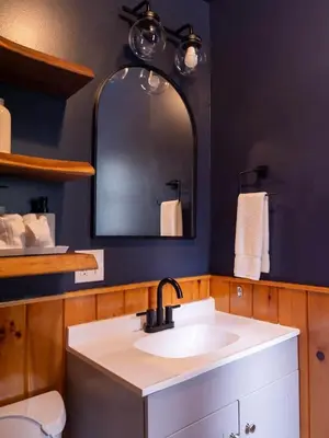 a bathroom with a sink and a mirror at Hunter Mountain View Cabin in Lanesville