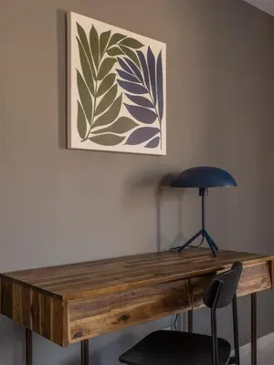 a wooden desk with a chair in front of a painting at Chic Cabin with Hot Tub and Fire Pit in Roscoe