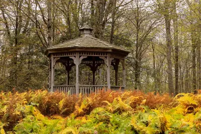 a gazebo in the middle of a garden at Private Chalet with Fire Pit Deck and Large Yard in Roscoe