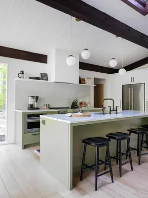 a kitchen with a large counter and stools in it at Private Cabin by River with Fireplace in Phoenicia