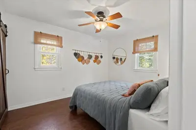 a bedroom with a ceiling fan and a bed at Cozy Home with Game Room and Fire Pit in New Paltz