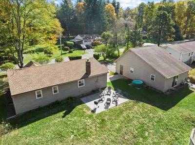 an aerial view of a house with a table and chairs at Cozy Home with Game Room and Fire Pit in New Paltz