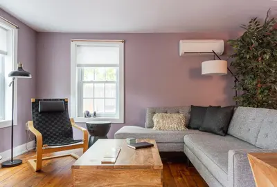 a living room with a couch and a table at Chic Farmhouse Woodstock Saugerties Skiing HITS in Saugerties