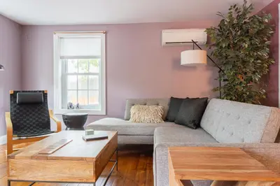 a living room with a couch and a coffee table at Chic Farmhouse Woodstock Saugerties Skiing HITS in Saugerties