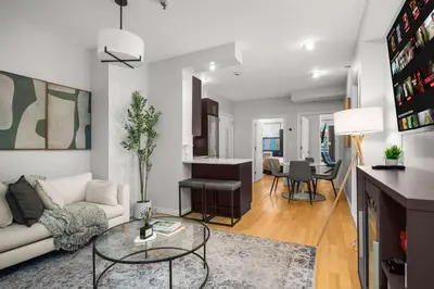 a living room with a couch and a table at Beautiful Apartment in NYC in New York
