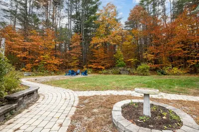 a stone walkway in a park with fall foliage at 3BR Lake Luzerne Retreat with Game Room & Cozy Fire Pit in Lake Luzerne