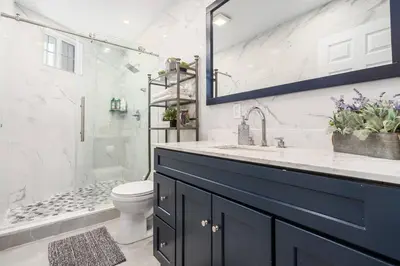 a bathroom with a sink and a toilet and a shower at Modern 3 Bed Apt Parking W D in Schenectady