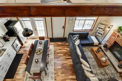 a living room with a couch and a table at Chalet retreat in Tobyhanna in Tobyhanna