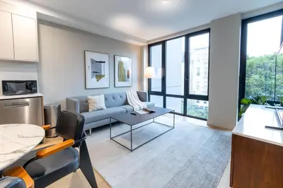 a living room with a couch and a table at 149BK-301 New Construction 1BR Prime BK WD in Brooklyn