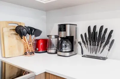 a kitchen counter with various kitchen utensils on it at 149BK-301 New Construction 1BR Prime BK WD in Brooklyn