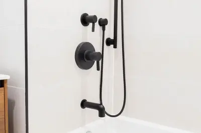 a shower with a black shower head in a bathroom at 149BK-301 New Construction 1BR Prime BK WD in Brooklyn